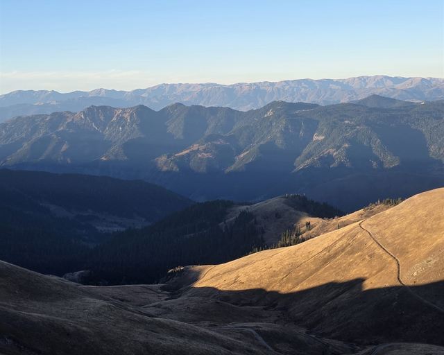 Golden mountain ridges under a clear sky