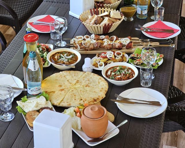 A table laid with appetizers and hot dishes