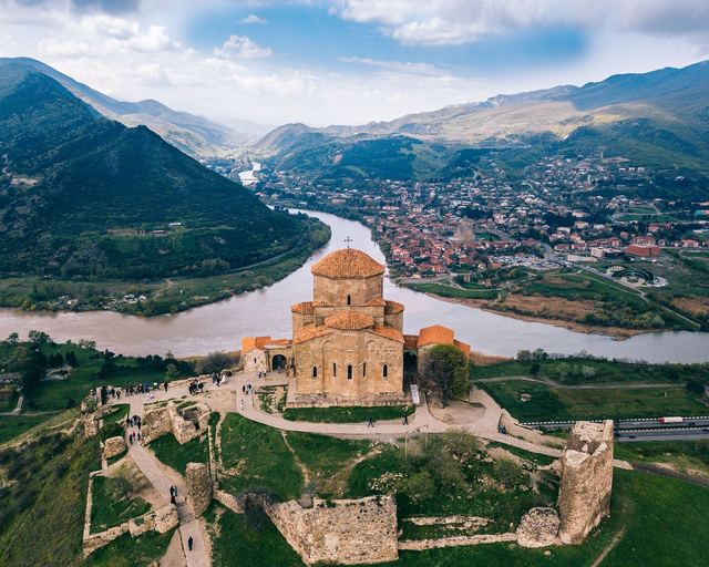A monastery on a hill above the meeting of two rivers